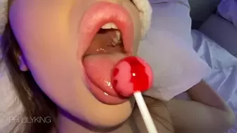 After school, she treated her vacationing younger sister to a lollipop.