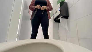 Secretary caught pissing in public bathroom