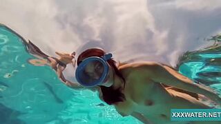 Cute brunette bitch Candy swims underwater